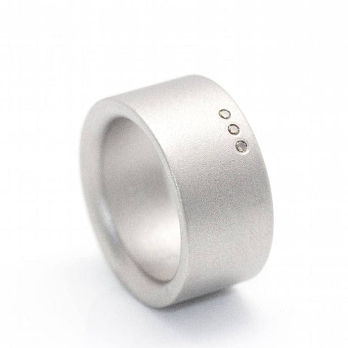 Bague 53 Niessing - Bague en acier sablé et diamants champagne 58 Facettes D359993JC
