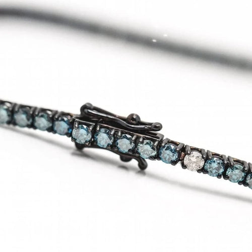 Bracelet Bracelet rivière en or blanc 18 ct et diamants bleus et blancs 58 Facettes D363133CG