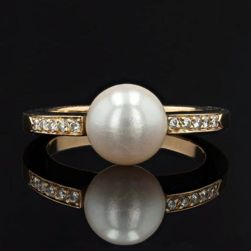 Bague 57 Bague en or jaune 18 carats avec perle et diamants 58 Facettes 22-298