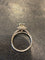 Solitaire ring in platinum with 0.85 ct diamond and diamond halo 
