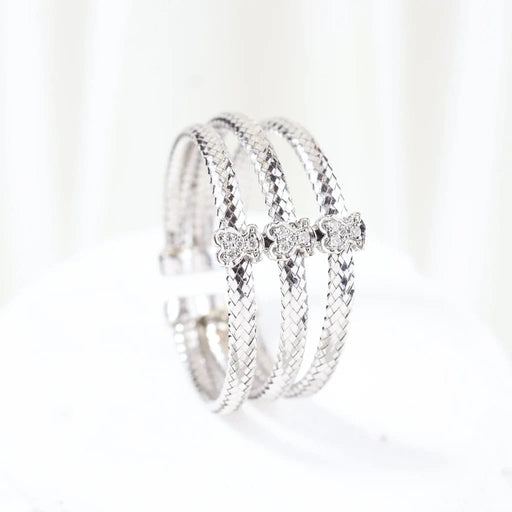 Bague 66 TOUS - Bague triple tressée en or blanc 18 carats et diamants 58 Facettes J000002214