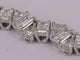 Bracelet Bracelet tennis en or blanc et diamants taille émeraude et poire 58 Facettes 3335