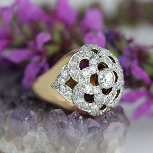 https://www.bijouxbaume.com/upload/image/bague-boule-ajouree-d-un-decor-de-fleur-et-diamants-p-image-172345-grande.jpg