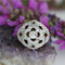 https://www.bijouxbaume.com/upload/image/bague-boule-ajouree-d-un-decor-de-fleur-et-diamants-p-image-172344-grande.jpg