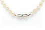 Collier Collier années 70 en or blanc 18 carats, émeraude et perles 58 Facettes B677