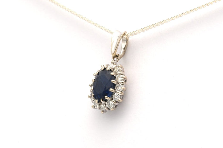 Pendentif Pendentif contemporain en or blanc 18 carats avec saphir et diamants 58 Facettes 21989