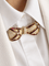 Broche Broche noeud or jaune rubis diamants 58 Facettes 1242.3