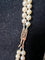 Collier Collier double rang de perles Akoya avec fermoir en or jaune, grenats et diamants 58 Facettes 933