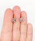 Boucles d'oreilles Dormeuses marguerite antiques en or rose 18k, platine, rubis synthétiques et diamants 58 Facettes A06712