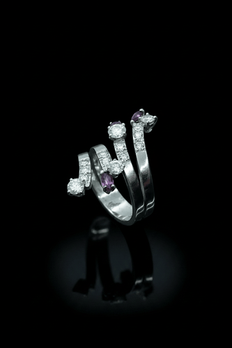 Bague 50 Anello serpentiforme en rubis et diamants 58 Facettes