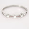 Bracelet Bracelet jonc ajouré en or gris 18K avec perles de culture et diamants 58 Facettes LF6