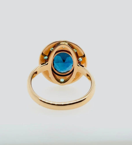 Bague 54 Bague - Topaze bleue et émeraudes en or rose 58 Facettes