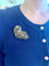 https://cdn.shopify.com/s/files/1/0647/1470/3075/files/Broche_Retro_-_Broche_Volute_Diamants_Or_Jaune_-_Bijouterie_Paris_-_Les_Pierres_de_Julie_13.jpg?v=1722603609