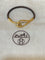 https://cdn.shopify.com/s/files/1/0647/1470/3075/files/Bracelet_Signe_-_Bracelet_Hermes_Jumbo_Dore_-_Joaillerie_Paris_-_Les_Pierres_de_Julie_1_2cc75272-a96b-4751-a9d5-66e4616d76e8.jpg?v=1759752502