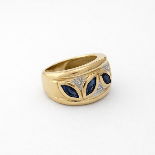 https://18carats.fr/wp-content/uploads/2026/03/35362-35381-Bague-en-or-jaune-sertie-de-saphirs-marquise-et-diamants.png