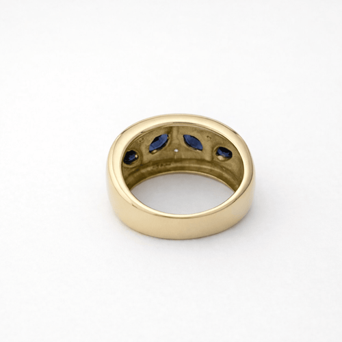 https://18carats.fr/wp-content/uploads/2026/03/35362-35382-Bague-en-or-jaune-sertie-de-saphirs-marquise-et-diamants.png