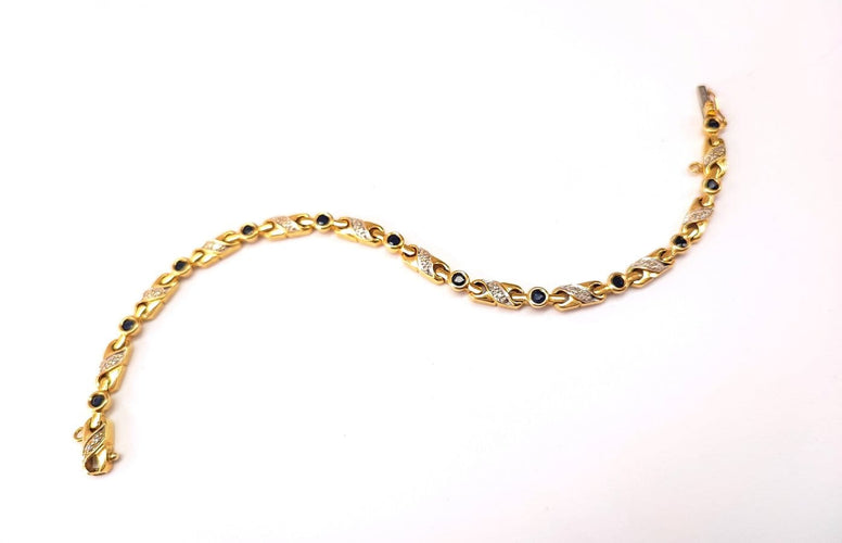 Bracelet Bracelet en or jaune 18K serti de diamants et saphirs 58 Facettes RIV-2129.2