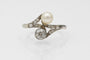 Bague 52 Bague Toi et Moi Art nouveau en or blanc 14 ct, perle et diamants 58 Facettes 11992