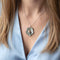 Collier Collier fleur en or blanc 18 carats avec nacre et perle de culture 58 Facettes 1777