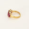 Bague 50 Bague jarretière en or jaune et or gris, rubis de synthèse 58 Facettes 260252