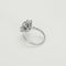 Bague 55 Bague Marguerite en or gris, émeraude et diamants 58 Facettes 260212