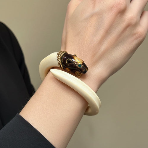 Bracelet Bracelet jonc animalier en ivoire et or jaune 18 carats 58 Facettes 1057/09