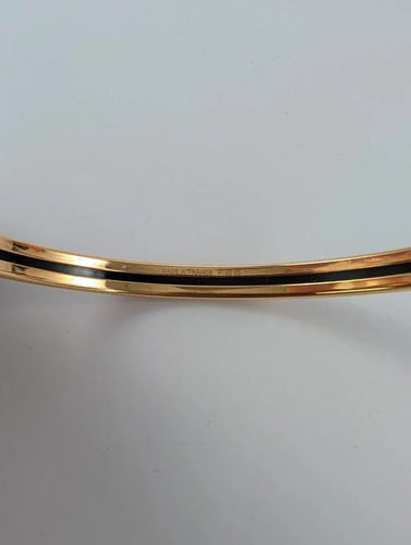Bracelet Hermès - Bracelet jonc De l'Ombrelle aux Duels en plaqué or rose et émail 58 Facettes 1143