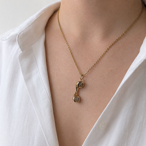 https://18carats.fr/wp-content/uploads/2026/04/36393-36534-Pendentif-combine-telephonique-en-or-jaune-et-diamants.png