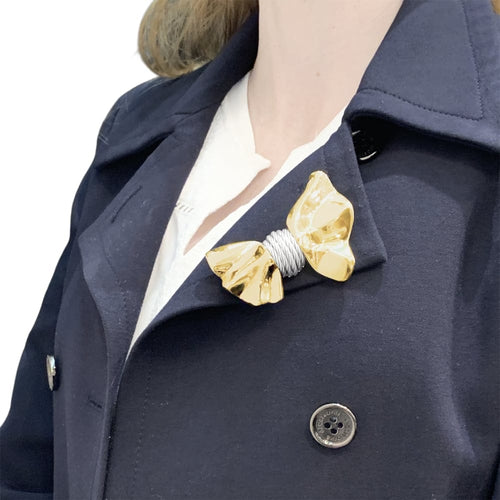 Broche Broche Fred, "Nœud", or jaune et acier. 58 Facettes 35428