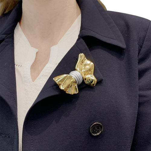 Broche Broche Fred, "Nœud", or jaune et acier. 58 Facettes 35428