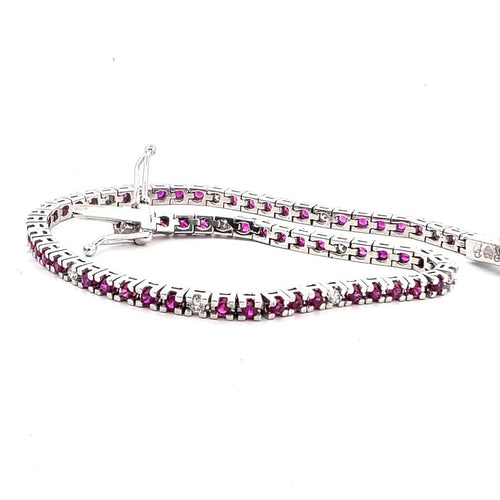 Bracelet Bracelet tennis en or blanc 18 kt, rubis et diamants 58 Facettes 236 OC