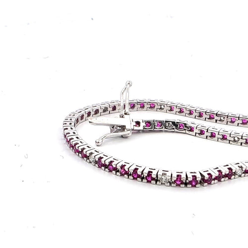 Bracelet Bracelet tennis en or blanc 18 kt, rubis et diamants 58 Facettes 236 OC