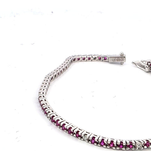 Bracelet Bracelet tennis en or blanc 18 kt, rubis et diamants 58 Facettes 236 OC