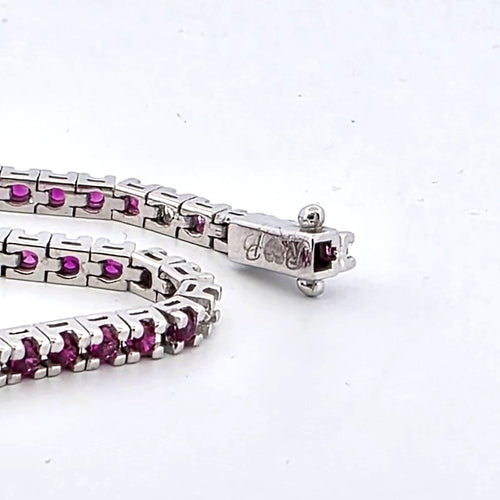Bracelet Bracelet tennis en or blanc 18 kt, rubis et diamants 58 Facettes 236 OC