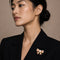 Broche Broche Nœud Or jaune, Rubis et Diamants 58 Facettes 65000020