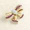 Broche Broche Nœud Or jaune, Rubis et Diamants 58 Facettes 65000020