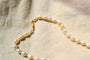 https://www.noircarat.fr/wp-content/uploads/2026/04/collier-ancien-perle.jpg