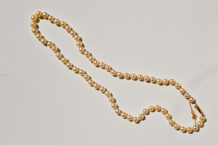 https://www.noircarat.fr/wp-content/uploads/2026/04/collier-vintage-perles.jpg