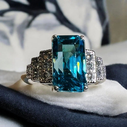 Bague 54 Bague Art déco en or blanc, zircon bleu et diamants 58 Facettes 7849 A
