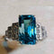 Bague 54 Bague Art déco en or blanc, zircon bleu et diamants 58 Facettes 7849 A