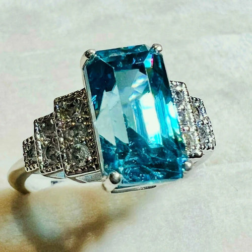 Bague 54 Bague Art déco en or blanc, zircon bleu et diamants 58 Facettes 7849 A