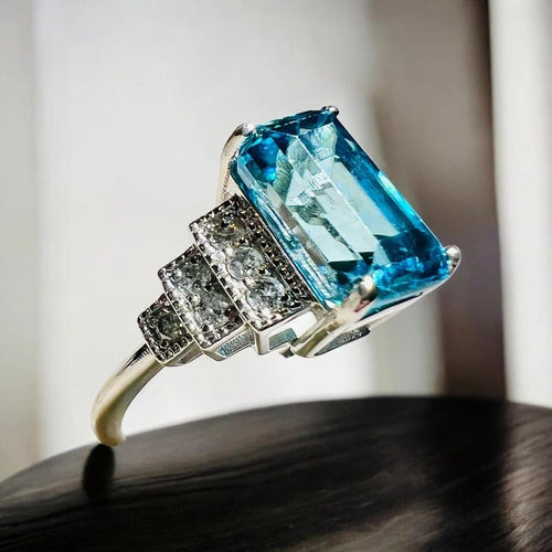 Bague 54 Bague Art déco en or blanc, zircon bleu et diamants 58 Facettes 7849 A