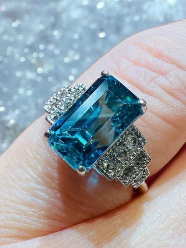 Bague 54 Bague Art déco en or blanc, zircon bleu et diamants 58 Facettes 7849 A