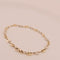 Bracelet Bracelet grain de café en or jaune et blanc 18 carats 58 Facettes 3042144