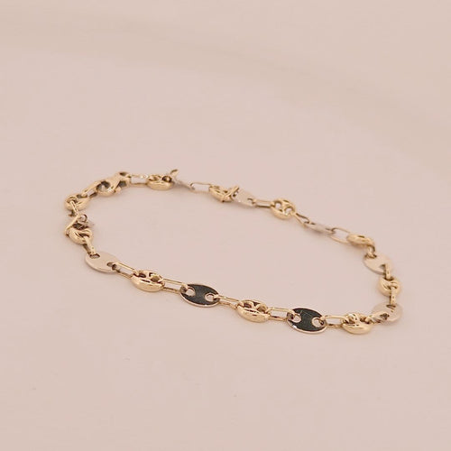 Bracelet Bracelet grain de café en or jaune et blanc 18 carats 58 Facettes 3042144