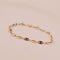 Bracelet Bracelet grain de café en or jaune et blanc 18 carats 58 Facettes 3042144