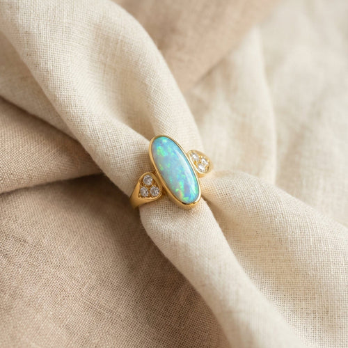 https://cdn.shopify.com/s/files/1/0442/6560/3235/files/boulder-opal-ring-aus-750-gelbgoldhoney-jewelry-3078448.jpg?v=1780031537