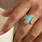 https://cdn.shopify.com/s/files/1/0442/6560/3235/files/boulder-opal-ring-aus-750-gelbgoldhoney-jewelry-6211078.jpg?v=1780031537