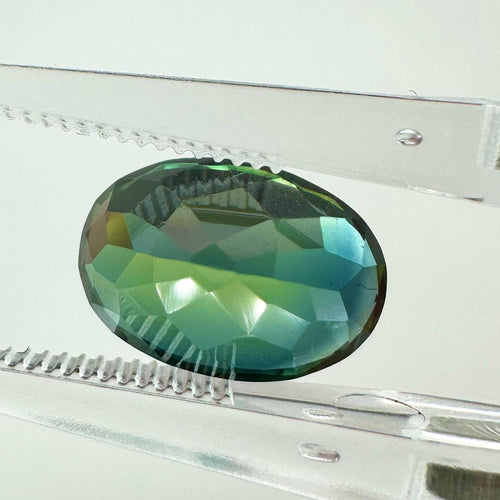 https://cdn.shopify.com/s/files/1/1015/8633/8124/files/unheated-oval-green-sapphire-back-view.jpg?v=1779879614