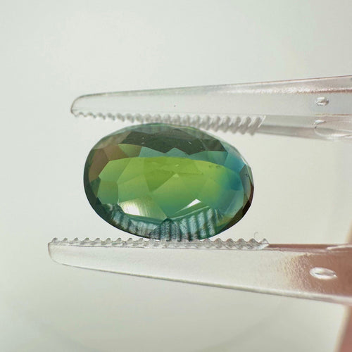 https://cdn.shopify.com/s/files/1/1015/8633/8124/files/unheated-oval-green-sapphire-back-view-1.jpg?v=1779879646